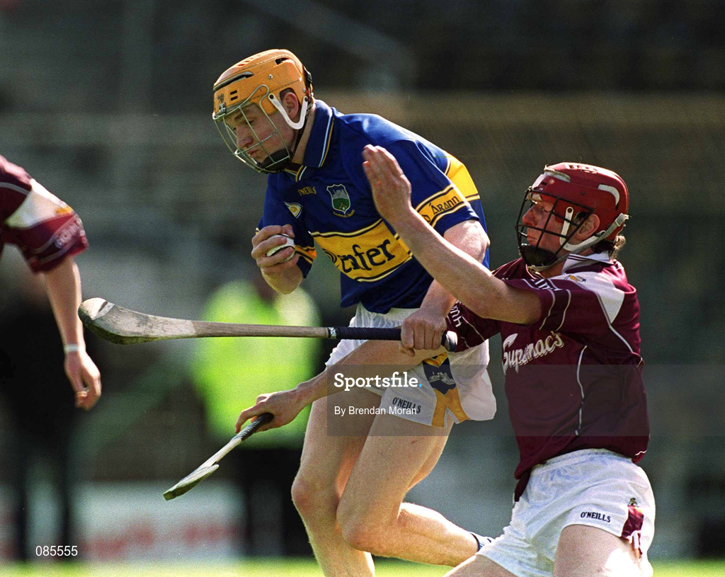 14 April 2002; Lar Corbett of Tipperary in action against Declan O'Brien of Galway during the Allianz National Hurling League Quarter-Final match between Galway and Tipperary at Semple Stadium in Thurles, Tipperary. Photo by Brendan Moran/Sportsfile