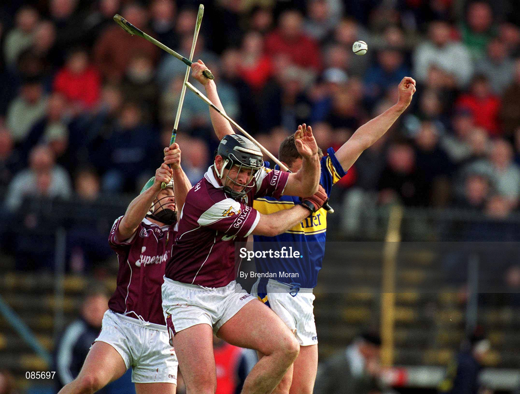 14 April 2002; Noel Morris of Tipperary in action against Joe Rabbitte and Fergal Healy, left, of Galway during the Allianz National Hurling League Quarter-Final match between Galway and Tipperary at Semple Stadium in Thurles, Tipperary. Photo by Brendan Moran/Sportsfile