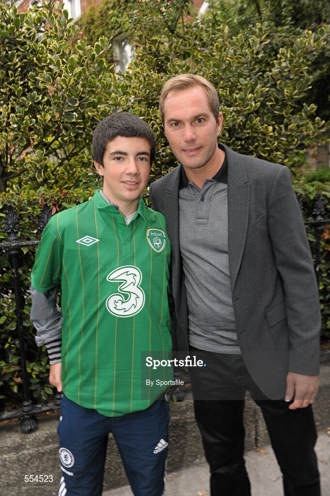 2 September 2011; Former Republic of Ireland star Jason McAteer, who scored the famous winning goal against Holland to secure a place at the 2002 World Cup ten years ago this week, with fan Robert Evans, from Kilcoole, Co. Wicklow at the Aviva Stadium where they were giving out free jerseys to fans as part of Threes Go Green with Pride campaign that is giving Irish fans the chance to trade in their old Republic of Ireland football jerseys in any Champion Sports store nationwide and get 20 off the brand new Republic of Ireland home jersey. The traded in jerseys will be collected and donated to Friends In Ireland, a charity founded by Marian Finucane that cares for orphans and vulnerable children affected by HIV/AIDS in South Africa. Aviva Stadium, Lansdowne Road, Dublin. Photo by Sportsfile