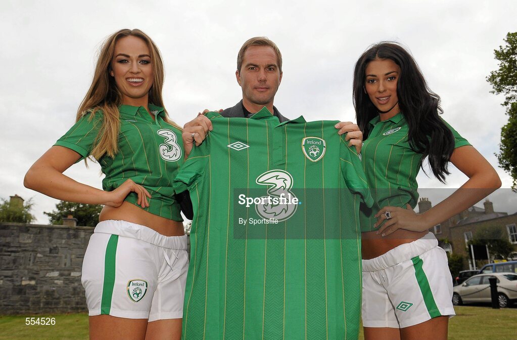 2 September 2011; Former Republic of Ireland star Jason McAteer, who scored the famous winning goal against Holland to secure a place at the 2002 World Cup ten years ago this week, with models Georgia Salpa and Daniella Moyles at the Aviva Stadium where they were giving out free jerseys to fans as part of Threes Go Green with Pride campaign that is giving Irish fans the chance to trade in their old Republic of Ireland football jerseys in any Champion Sports store nationwide and get 20 off the brand new Republic of Ireland home jersey. The traded in jerseys will be collected and donated to Friends In Ireland, a charity founded by Marian Finucane that cares for orphans and vulnerable children affected by HIV/AIDS in South Africa. Aviva Stadium, Lansdowne Road, Dublin. Photo by Sportsfile