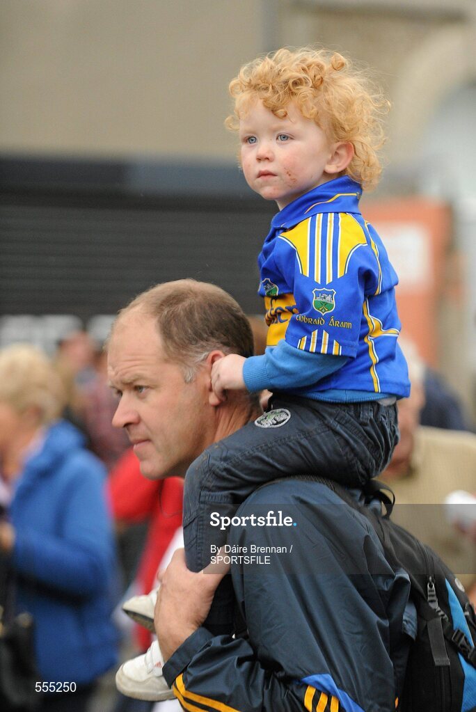 4 September 2011; Michael Leamy, from Roscrea, Co. Tipperary, carries his son Ben on his shoulders to the game. Ben is 2 years and 3 months old and is attending his third All-Ireland senior final today. Supporters at the GAA Hurling All-Ireland Championship Finals, Croke Park, Dublin. Picture credit: Dáire Brennan / SPORTSFILE