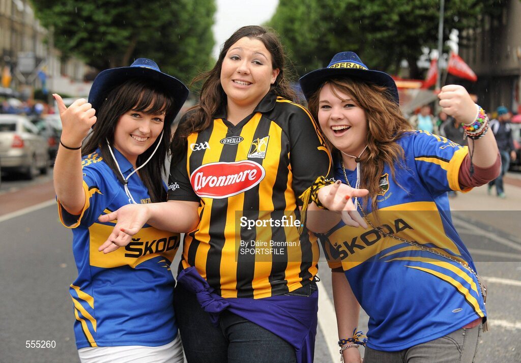 4 September 2011; Kilkenny supporter Gwen Fitzpatrick, from Johnstown, Co. Kilkenny, is surrounded by Tipperary supporters Michelle Ryan, left, from Drom and Inch, and Claire Morrissey, from Kilenaule, Co. Tipperary. Supporters at the GAA Hurling All-Ireland Championship Finals, Croke Park, Dublin. Picture credit: Dáire Brennan / SPORTSFILE