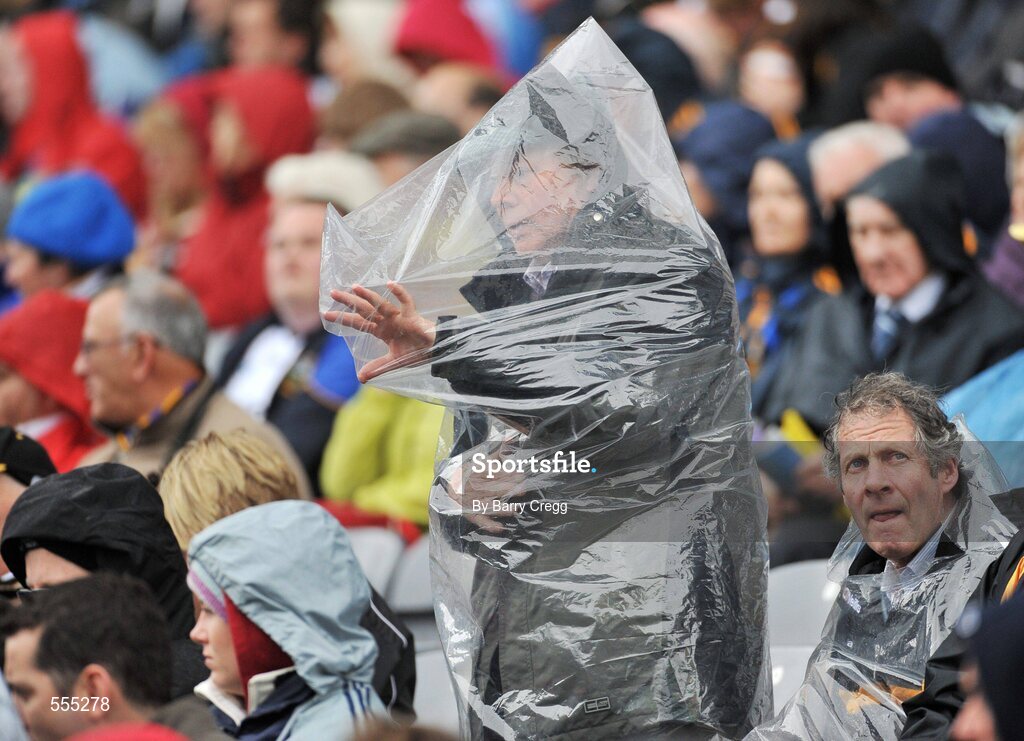 4 September 2011; A suppporter prepares for the bad weather during the minor match. Supporters at the GAA Hurling All-Ireland Championship Finals, Croke Park, Dublin. Picture credit: Barry Cregg / SPORTSFILE