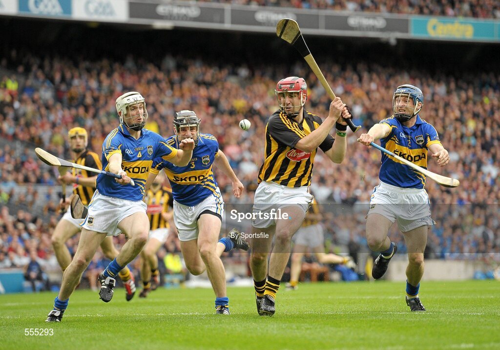 4 September 2011; Eoin Larkin, Kilkenny, in action against Michael Cahill, left, Paul Curran, and Paddy Stapleton, right, Tipperary. GAA Hurling All-Ireland Senior Championship Final, Kilkenny v Tipperary, Croke Park, Dublin. Photo by Sportsfile