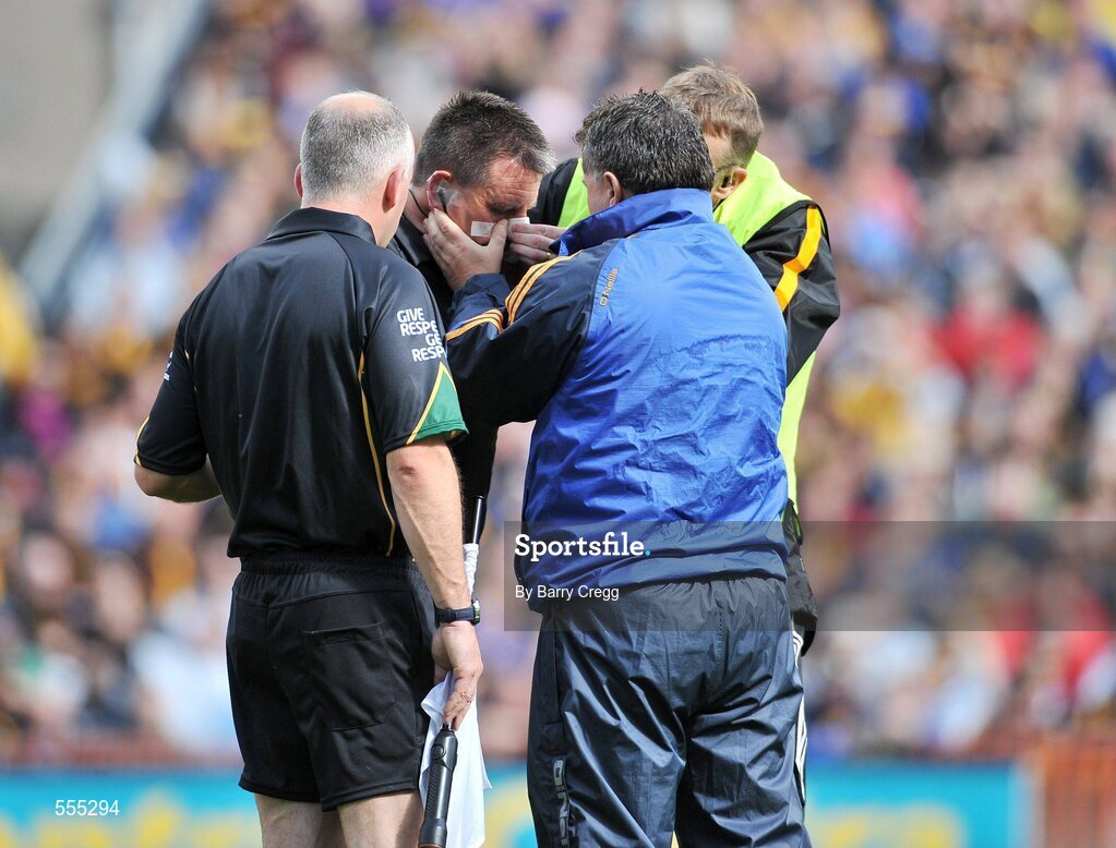 4 September 2011; Referee Brian Gavin is treated for an injury by Kilkenny and Tiperary doctors. GAA Hurling All-Ireland Senior Championship Final, Kilkenny v Tipperary, Croke Park, Dublin. Picture credit: Barry Cregg / SPORTSFILE