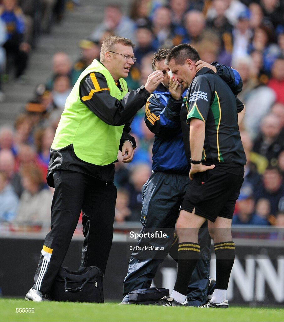 4 September 2011; Referee Brian Gavin is attended to by Dr. Brian Hogan, left, the Kilkenny doctor, and Dr Peter Murchin, the Tipperary doctor after he had received a cut on his nose. GAA Hurling All-Ireland Senior Championship Final, Kilkenny v Tipperary, Croke Park, Dublin. Picture credit: Ray McManus / SPORTSFILE