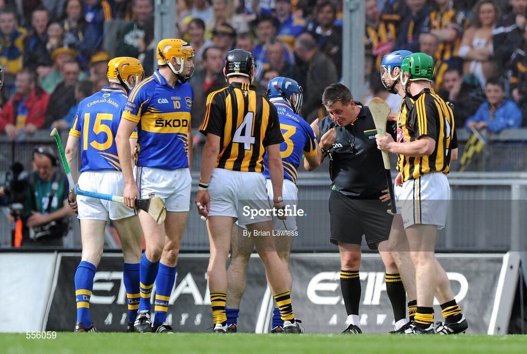4 September 2011; Referee Brian Gavin after he received an accidental clip which resulted in a few minutes delay as he was attended to by the two team doctors. GAA Hurling All-Ireland Senior Championship Final, Kilkenny v Tipperary, Croke Park, Dublin. Picture credit: Brian Lawless / SPORTSFILE