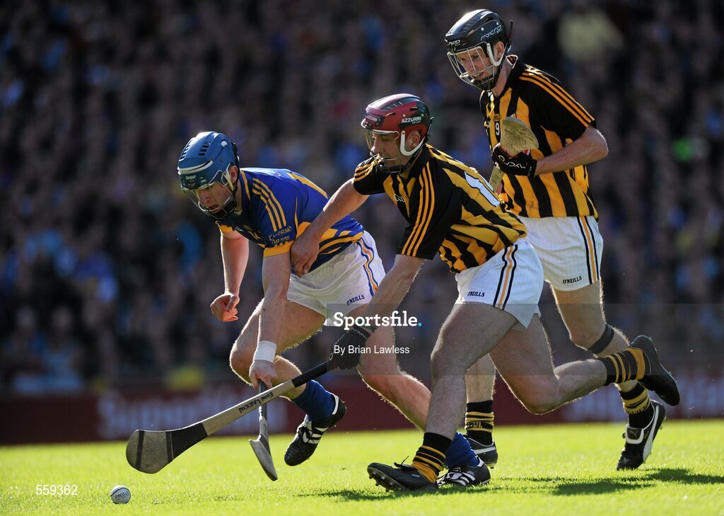 4 September 2011; John O'Brien, Tipperary, in action against Eoin Larkin and Michael Rice, right, Kilkenny. GAA Hurling All-Ireland Senior Championship Final, Kilkenny v Tipperary, Croke Park, Dublin. Picture credit: Brian Lawless / SPORTSFILE
