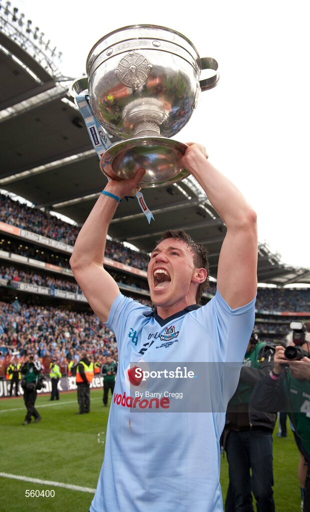 18 September 2011; Éamon Fennell, Dublin, celebrates victory with the Sam Maguire cup at Hill 16. GAA Football All-Ireland Senior Championship Final, Kerry v Dublin, Croke Park, Dublin. Picture credit: Barry Cregg / SPORTSFILE