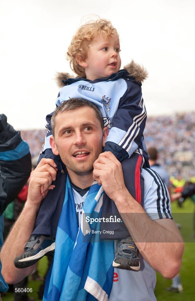 18 September 2011; Alan Brogan, Dublin, carries his son Jamie, aged 2, on his shoulders as he celebrates victory after the game. GAA Football All-Ireland Senior Championship Final, Kerry v Dublin, Croke Park, Dublin. Picture credit: Barry Cregg / SPORTSFILE