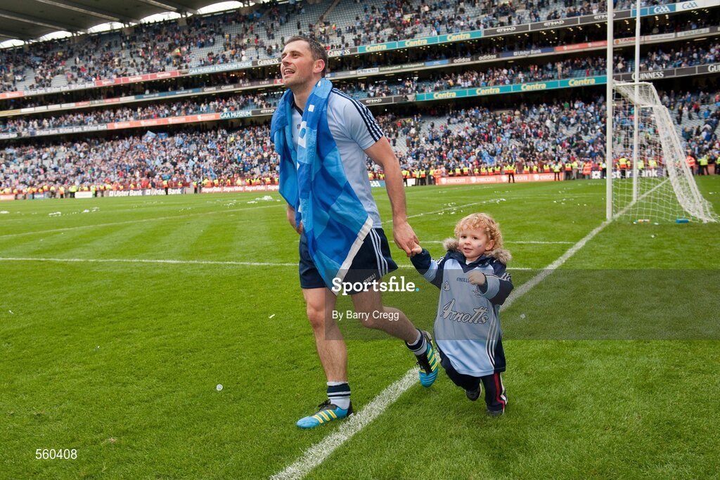 18 September 2011; Alan Brogan, Dublin, with his son Jamie, aged 2, as he celebrates victory after the game. GAA Football All-Ireland Senior Championship Final, Kerry v Dublin, Croke Park, Dublin. Picture credit: Barry Cregg / SPORTSFILE