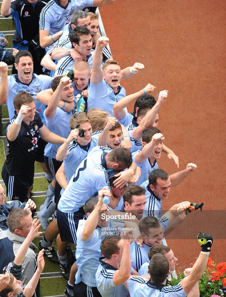 18 September 2011; Dublin players celebrate on the steps of the Hogan Stand as team-mate Bryan Cullen lifts the Sam Maguire cup. GAA Football All-Ireland Senior Championship Final, Kerry v Dublin, Croke Park, Dublin. Picture credit: Dáire Brennan / SPORTSFILE