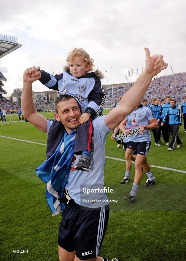 18 September 2011; Alan Brogan, Dublin, with his son Jamie, aged 2, celebrates victory after the game. GAA Football All-Ireland Senior Championship Final, Kerry v Dublin, Croke Park, Dublin. Picture credit: Stephen McCarthy / SPORTSFILE