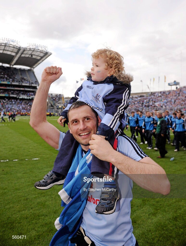 18 September 2011; Alan Brogan, Dublin, with his son Jamie, aged 2, celebrates victory after the game. GAA Football All-Ireland Senior Championship Final, Kerry v Dublin, Croke Park, Dublin. Picture credit: Stephen McCarthy / SPORTSFILE