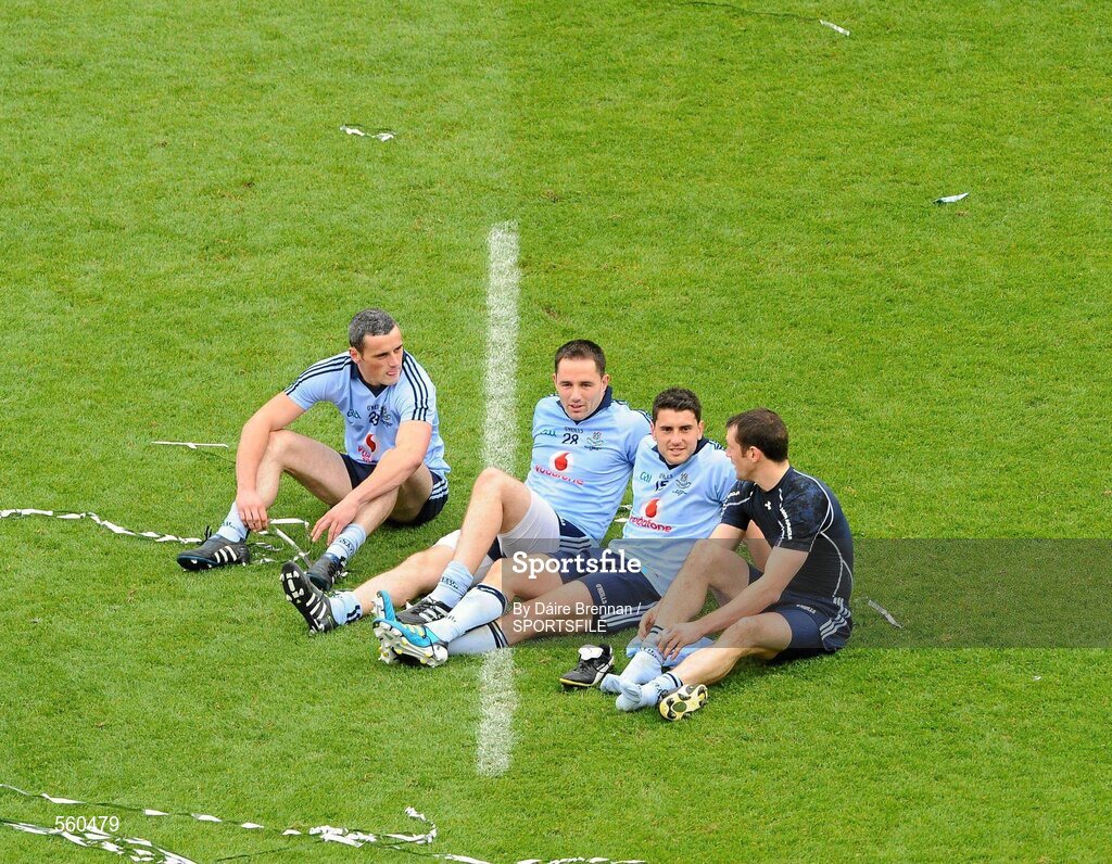 18 September 2011; Dublin players, left to right, Paul Brogan, Declan Lally, Bernard Brogan, and Denis Bastick, savour the moment by relaxing in the middle of the pitch after the game. GAA Football All-Ireland Senior Championship Final, Kerry v Dublin, Croke Park, Dublin. Picture credit: Dáire Brennan / SPORTSFILE
