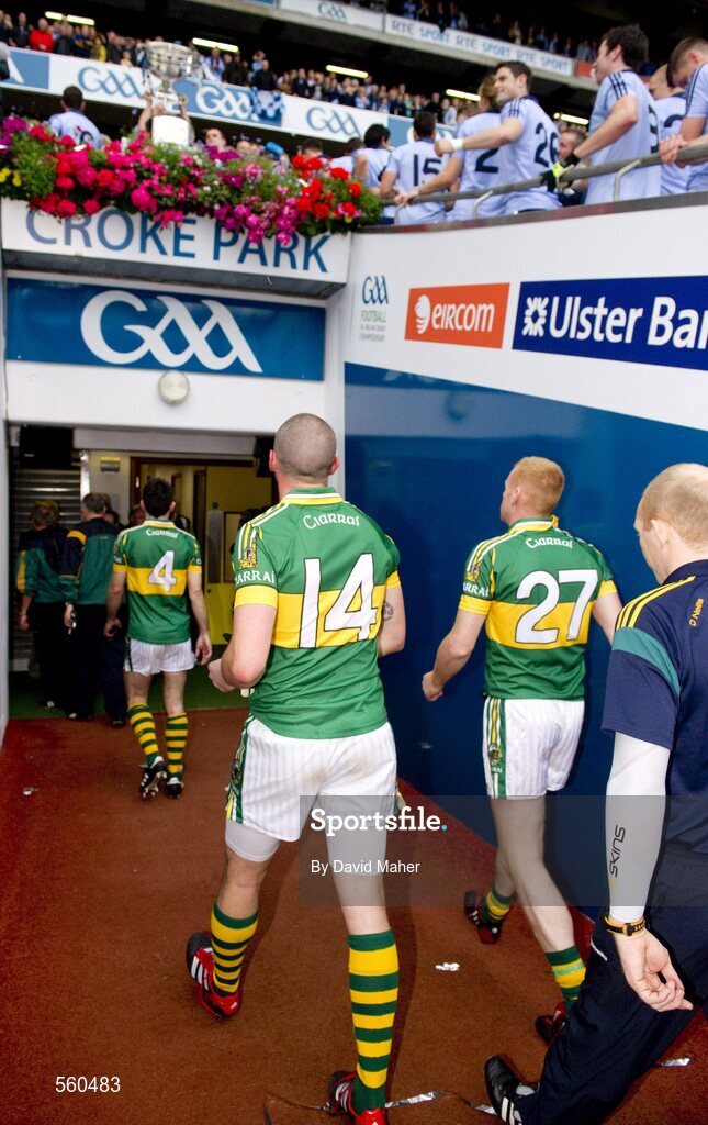 18 September 2011; Kieran Donaghy, 14,  Kerry, walks back to his team's dressing room as the Dublin players celebrate, at the end of the game, by lifting the Sam Maguire cup. GAA Football All-Ireland Senior Championship Final, Kerry v Dublin, Croke Park, Dublin. Picture credit: David Maher / SPORTSFILE