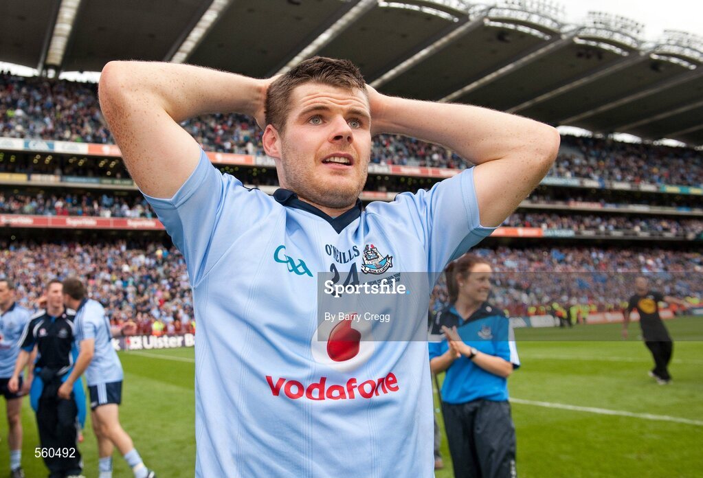 18 September 2011; Kevin McManamon, Dublin, takes it all in as his team-mates celebrate victory after the game. GAA Football All-Ireland Senior Championship Final, Kerry v Dublin, Croke Park, Dublin. Picture credit: Barry Cregg / SPORTSFILE