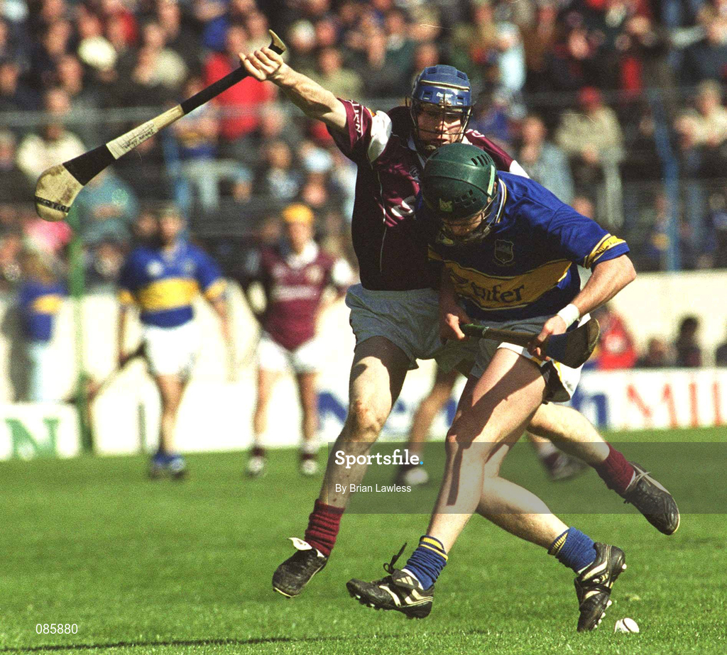 14 April 2002; David Kennedy of Tipperary in action against Damien Hayes of Galway during the Allianz National Hurling League Quarter-Final match between Galway and Tipperary at Semple Stadium in Thurles, Tipperary. Photo by Brian Lawless/Sportsfile