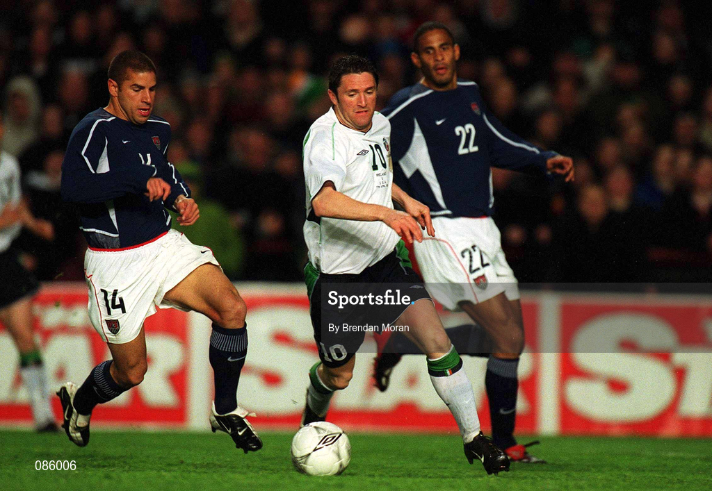 17 April 2002; Robbie Keane  of Republic of Ireland in action against Chris Armas, left and Tony Sanneh of USA during the International Friendly match between Republic of Ireland and USA at Lansdowne Road in Dublin. Photo by Brendan Moran/Sportsfile
