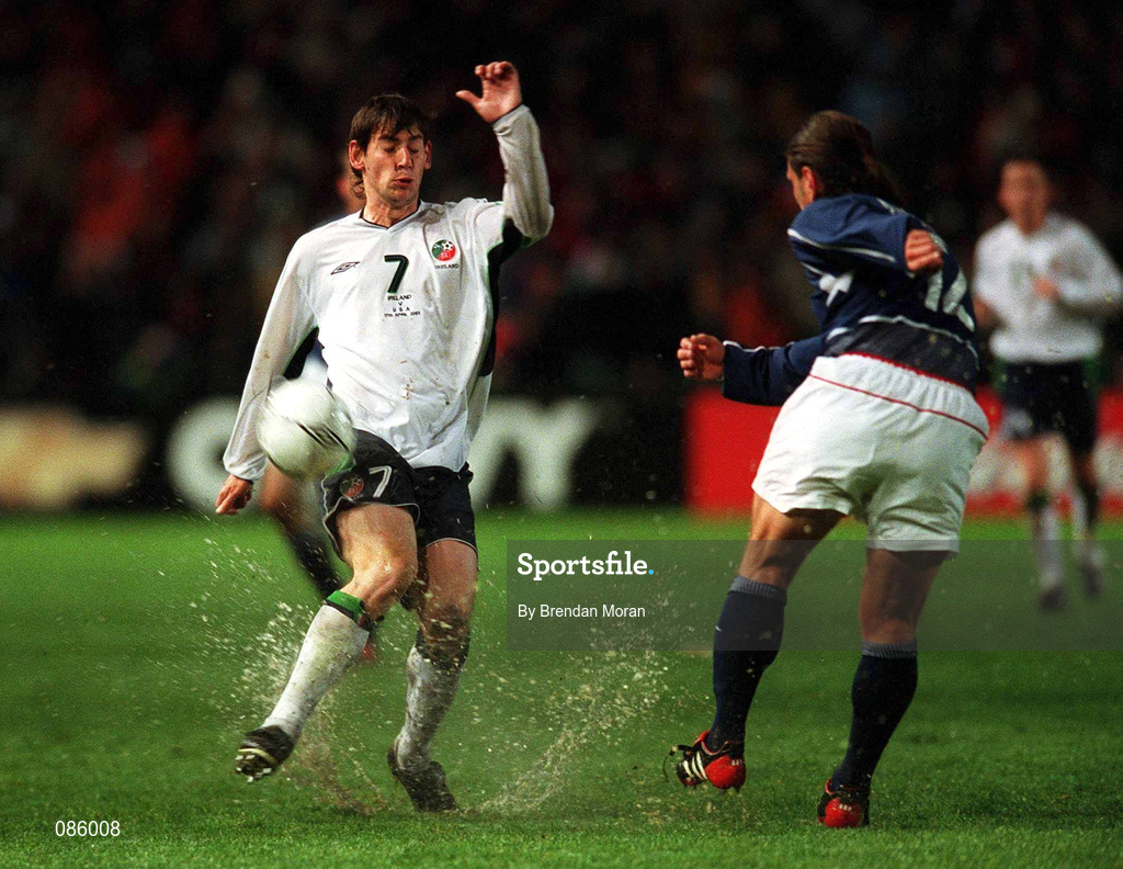 17 April 2002; Jeff Agoos of USA clears under pressure from Rory Delap of Republic of Ireland during the International Friendly match between Republic of Ireland and USA at Lansdowne Road in Dublin. Photo by Brendan Moran/Sportsfile