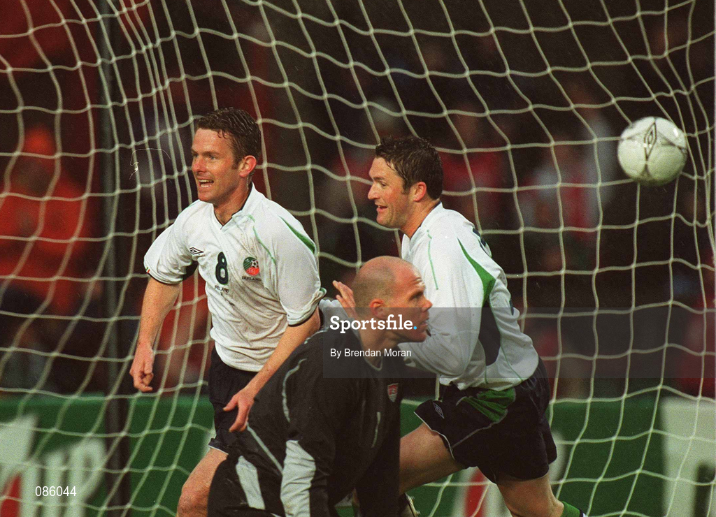 17 April 2002; Mark Kinsella of Republic of Ireland, left, celebrates with team-mate Robbie Keane after scoring his side's first goal as USA goalkeeper Brad Friedel looks on during the International Friendly match between Republic of Ireland and USA at Lansdowne Road in Dublin. Photo by Brendan Moran/Sportsfile