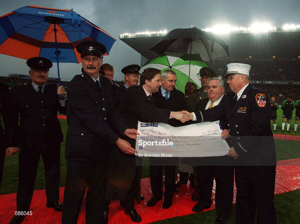 17 April 2002; New York Fire Department officers Jack Ginty and Kevin Gallagher accept a cheque from Dublin Firefighters John Moody and Brian Murray in the presence of The Lord Mayor of Dublin Alderman Michael Mulcahy and An Taoiseach Bertie Ahern TD prior to the International Friendly match between Republic of Ireland and USA at Lansdowne Road in Dublin. Photo by Brendan Moran/Sportsfile