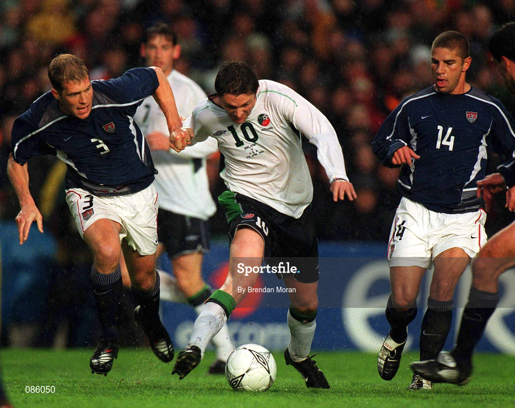 17 April 2002; Robbie Keane of Republic of Ireland in action against Gregg Berhalter, 3, and Chris Armas of USA during the International Friendly match between Republic of Ireland and USA at Lansdowne Road in Dublin. Photo by Brendan Moran/Sportsfile