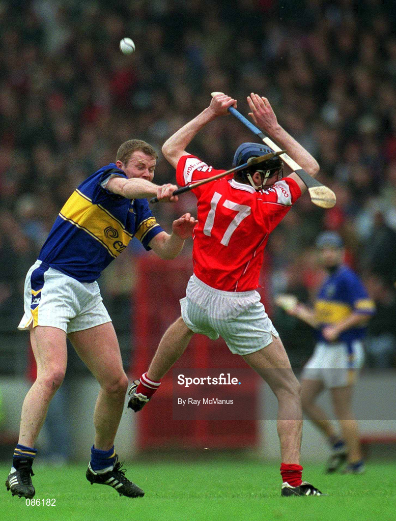 21 April 2002; Conor Gleeson of Tipperary in action against Pat Mulcahy of Cork during the Allianz National Hurling League Semi-Final match between Cork and Tipperary at Páirc Uí Chaoimh in Cork. Photo by Ray McManus/Sportsfile