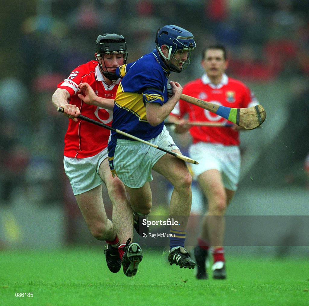 21 April 2002; Paul Kelly of Tipperary in action against Kieran Murphy of Cork during the Allianz National Hurling League Semi-Final match between Cork and Tipperary at Páirc Uí Chaoimh in Cork. Photo by Ray McManus/Sportsfile