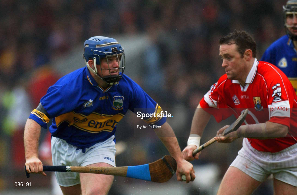 21 April 2002; Eugene O'Neill of Tipperary in action against Fergal Ryan of Cork during the Allianz National Hurling League Semi-Final match between Cork and Tipperary at Páirc Uí Chaoimh in Cork. Photo by Aoife Rice/Sportsfile