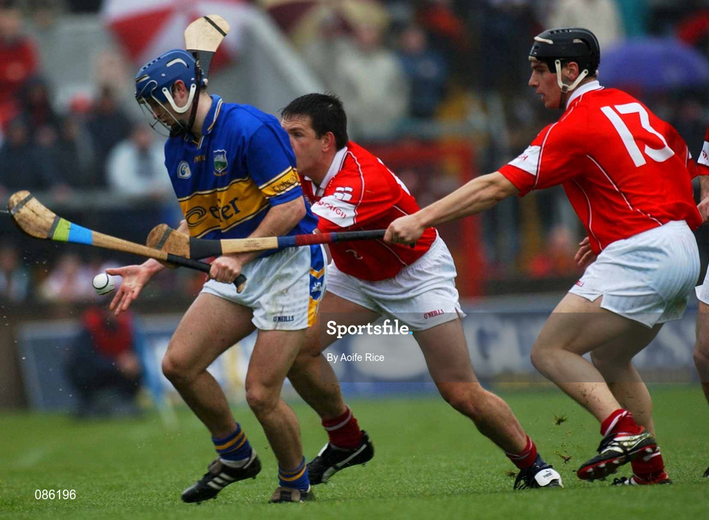 21 April 2002; Paul Kelly of Tipperary in action against Alan Browne and Eamonn Collins, 13, of Cork during the Allianz National Hurling League Semi-Final match between Cork and Tipperary at Páirc Uí Chaoimh in Cork. Photo by Aoife Rice/Sportsfile