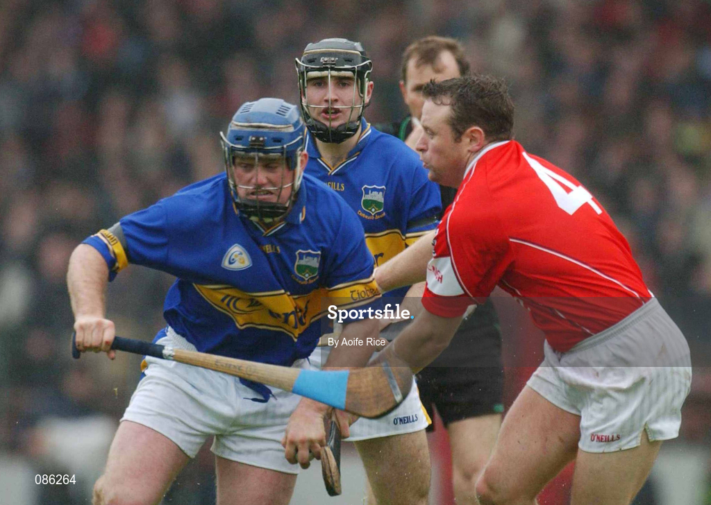 21 April 2002; Eugene O'Neill of Tipperary in action against Fergal Ryan of Cork during the Allianz National Hurling League Semi-Final match between Cork and Tipperary at Páirc Uí Chaoimh in Cork. Photo by Aoife Rice/Sportsfile