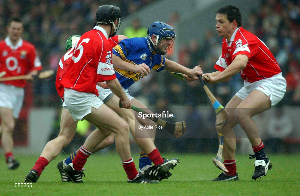 21 April 2002; Paul Kelly of Tipperary in action against Cork players, from left, Niall McCarthy, Ben O'Connor and Alan Browne during the Allianz National Hurling League Semi-Final match between Cork and Tipperary at Páirc Uí Chaoimh in Cork. Photo by Aoife Rice/Sportsfile