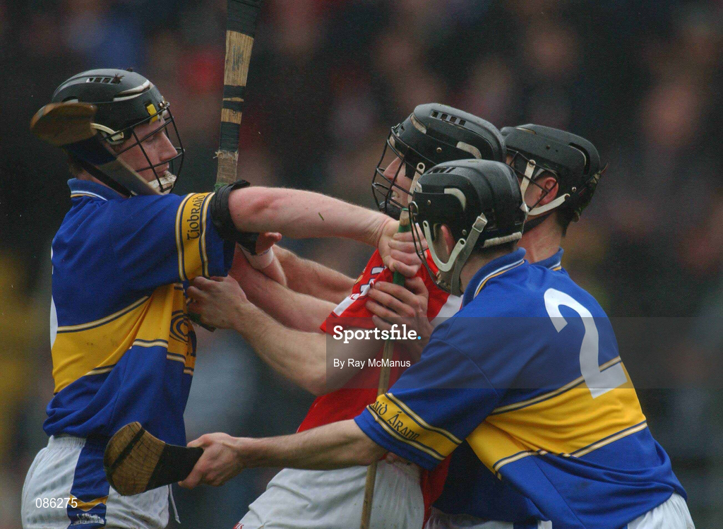 21 April 2002; Ben O'Connor of Cork in action against Tipperary players, from left, Philip Maher, Thomas Dunne and Thomas Costello, 2, during the Allianz National Hurling League Semi-Final match between Cork and Tipperary at Páirc Uí Chaoimh in Cork. Photo by Ray McManus/Sportsfile