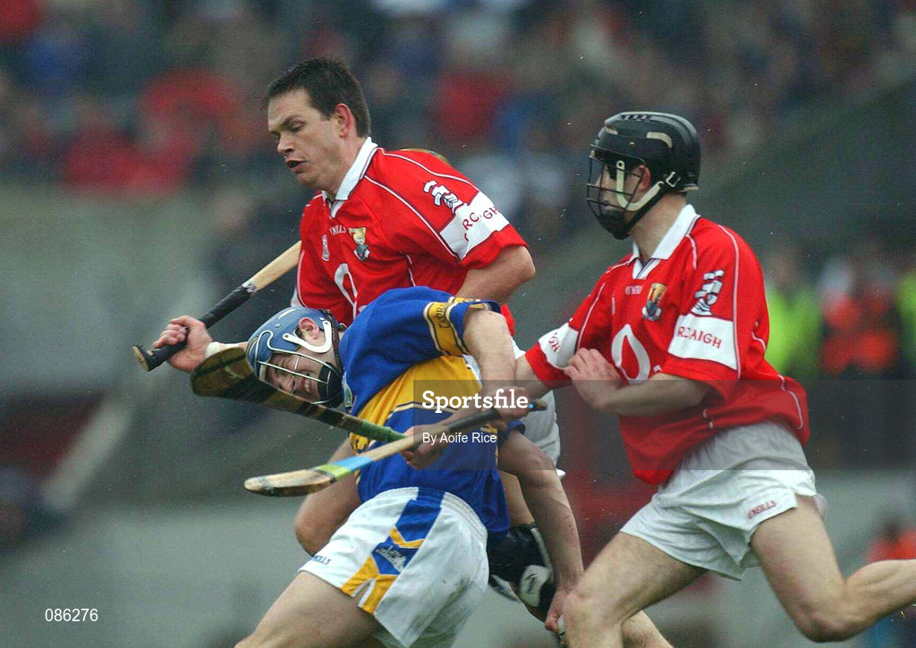 21 April 2002; Paul Kelly of Tipperary in action against Alan Browne and team-mate Ben O'Connor, right, of Cork during the Allianz National Hurling League Semi-Final match between Cork and Tipperary at Páirc Uí Chaoimh in Cork. Photo by Aoife Rice/Sportsfile