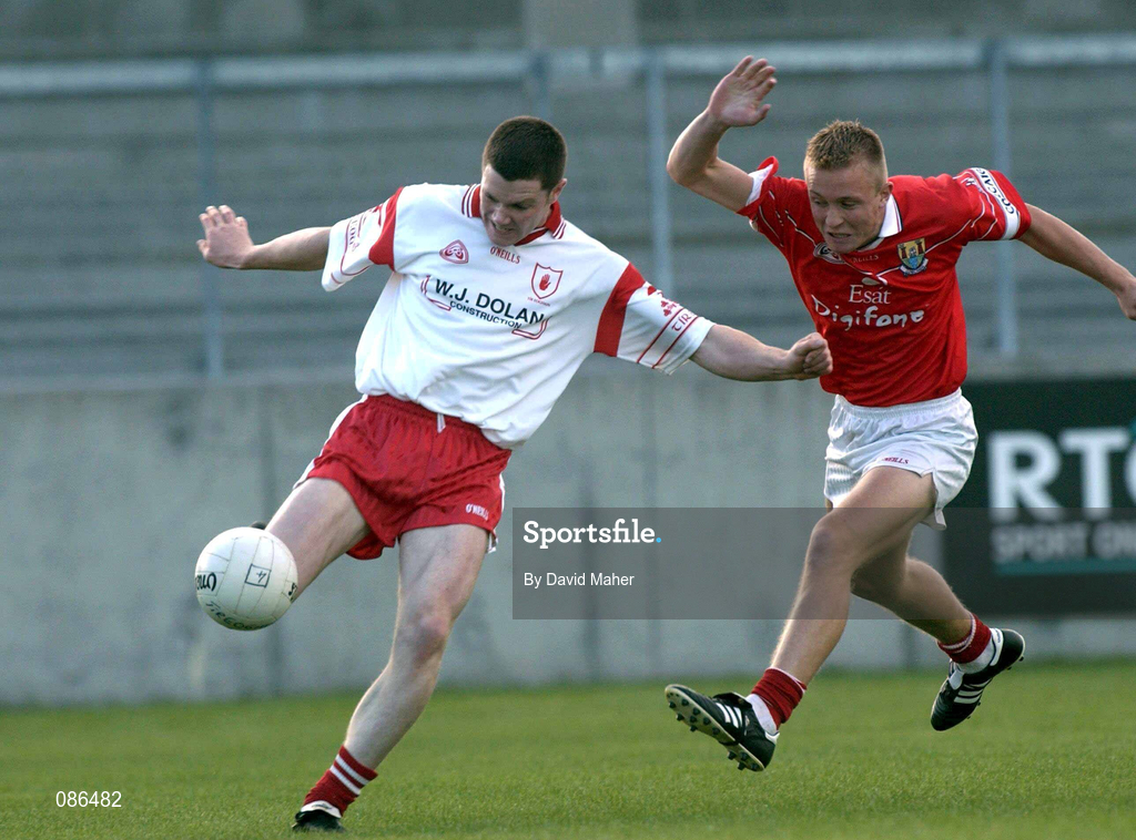 9 September 2001; Enda McGinley of Tyrone in action against Conrad Murphy of Cork during the All-Ireland Under 21 Football Championship Semi-Final match between Tyrone and Cork at Parnell Park in Dublin. Photo by David Maher/Sportsfile