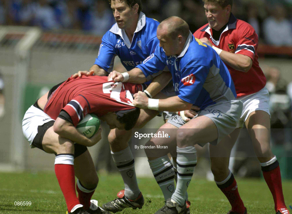 27 April 2002; Jason Holland of Munster is tackled by Gregor Townsend and Ugo Mola of Castres during the Heineken European Cup Semi-Final match between Castres and Munster at Stade de la Mediterranie in Beziers, France. Photo by Brendan Moran/Sportsfile