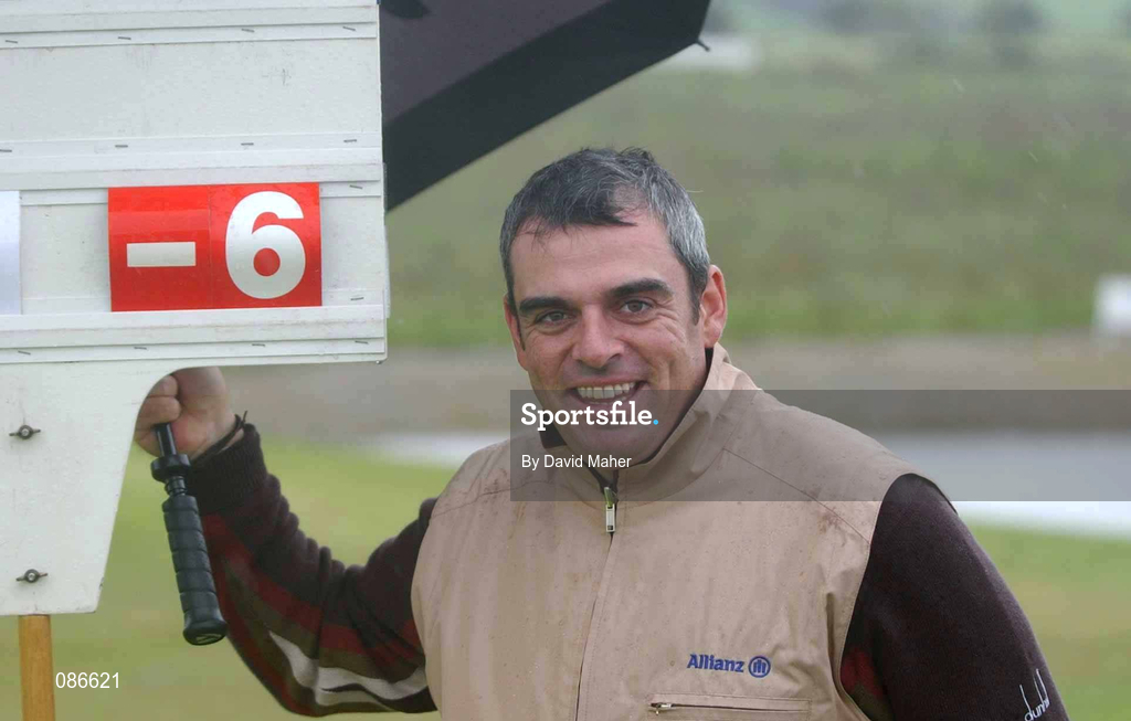 27 April 2002; Paul McGinley passes the scorekeepers board  as his walks off the 18th green showing his finishing score of 6 under and a course record of 65 during day three of the Smurfit Irish PGA Championship at Westport Golf Club in Westport, Mayo. Photo by David Maher/Sportsfile