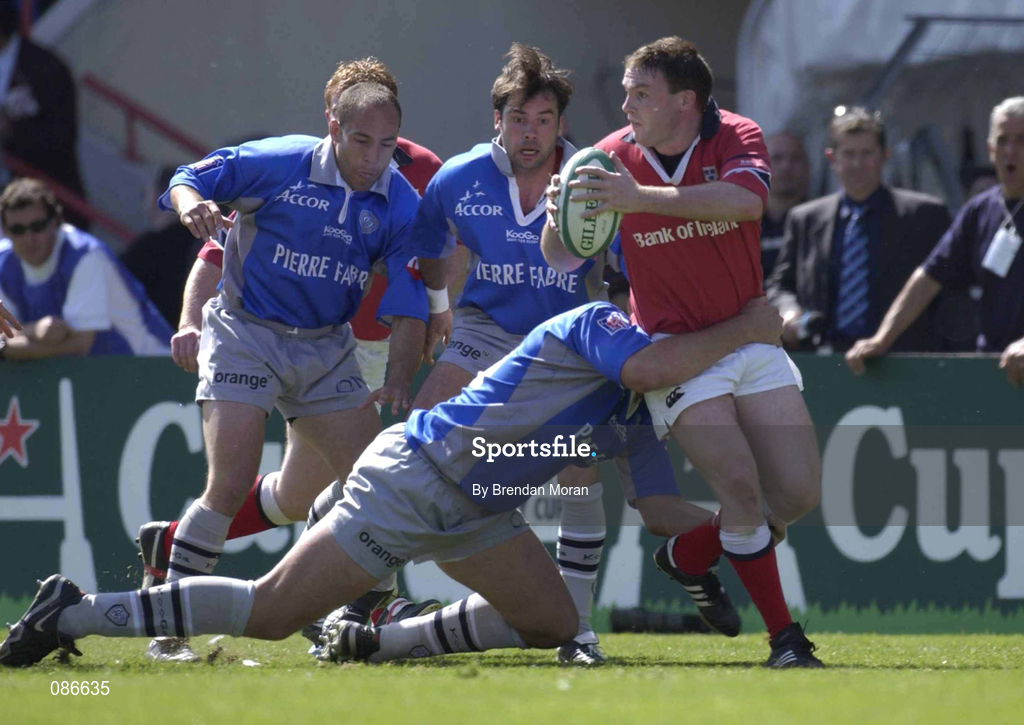 27 April 2002; John Kelly of Munster is tackled by Nicolas Spangherot of Castres during the Heineken European Cup Semi-Final match between Castres and Munster at Stade de la Mediterranie in Beziers, France. Photo by Brendan Moran/Sportsfile