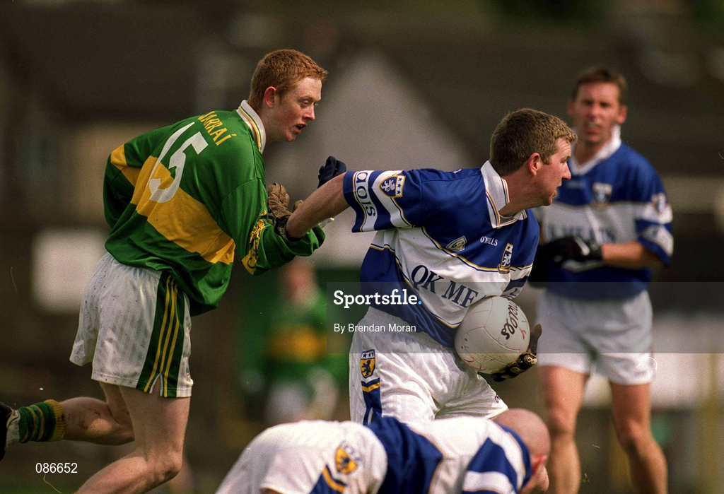 28 April 2002; Paul McDonald of Laois is tackled by Colm Cooper of Kerry during the Allianz National Football League Division 2 Final match between Kerry and Laois at the Gaelic Grounds in Limerick. Photo by Brendan Moran/Sportsfile