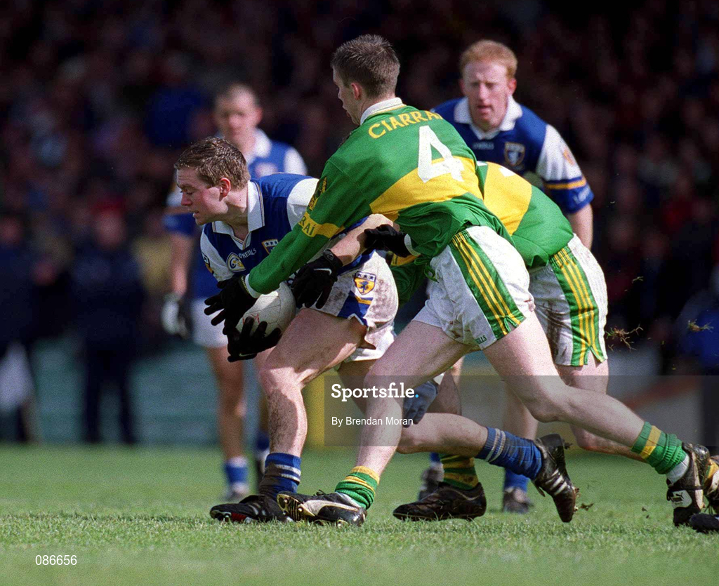 28 April 2002; Chris Conway of Laois is tackled by Marc Ó Sé of Kerry during the Allianz National Football League Division 2 Final match between Kerry and Laois at the Gaelic Grounds in Limerick. Photo by Brendan Moran/Sportsfile