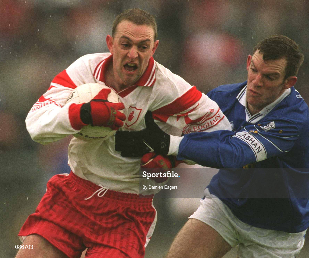 28 April 2002; Gerard Cavlan of Tyrone is tackled by Cathal Collins of Cavan during the Allianz National Football League Division 1 Final match between Tyrone and Cavan at St Tiernach's Park in Clones, Monaghan. Photo by Damien Eagers/Sportsfile