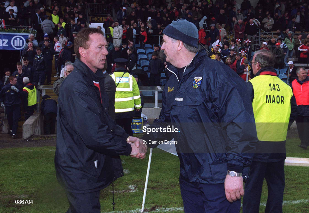 28 April 2002; Eugene McKenna, left, Tyrone manager, shakes hands with Mattie Kerrigan, Cavan manager, at the final whistle. Tyrone v Cavan, Allianz National Football League Final, St. Tighnearnachs Park, Clones, Co. Monaghan. Picture credit; Damien Eagers / SPORTSFILE