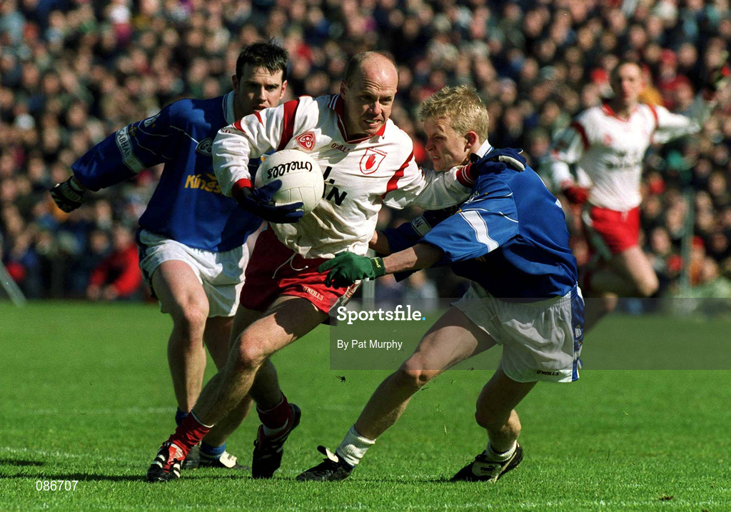 28 April 2002; Peter Canavan of Tyrone in action against Michael Bridges of Cavan during the Allianz National Football League Division 1 Final match between Tyrone and Cavan at St Tiernach's Park in Clones, Monaghan. Photo by Pat Murphy/Sportsfile