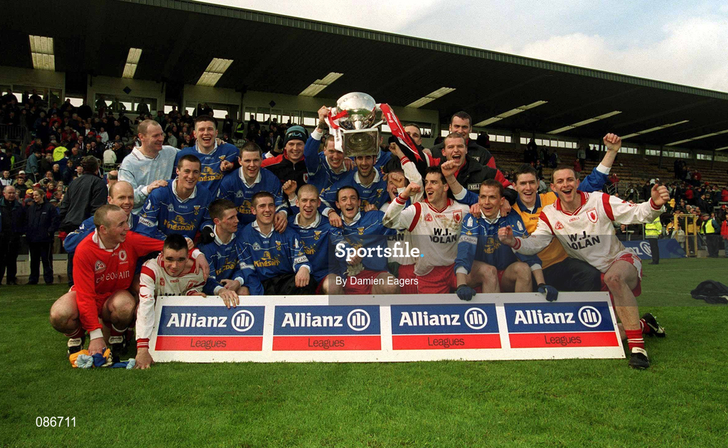 28 April 2002; Tyrone players celebrate after the Allianz National Football League Division 1 Final match between Tyrone and Cavan at St Tiernach's Park in Clones, Monaghan. Photo by Damien Eagers/Sportsfile