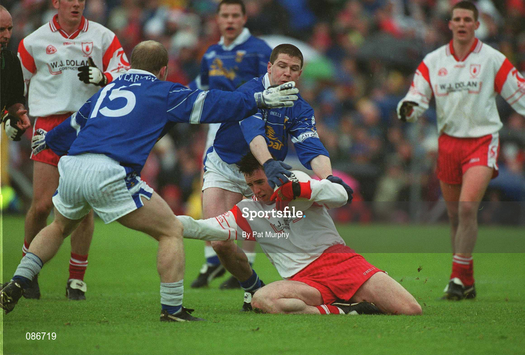 28 April 2002; Brian Robinson of Tyrone in action against Larry Reilly and Mickey Graham, 15, of Cavan during the Allianz National Football League Division 1 Final match between Tyrone and Cavan at St Tiernach's Park in Clones, Monaghan. Photo by Pat Murphy/Sportsfile