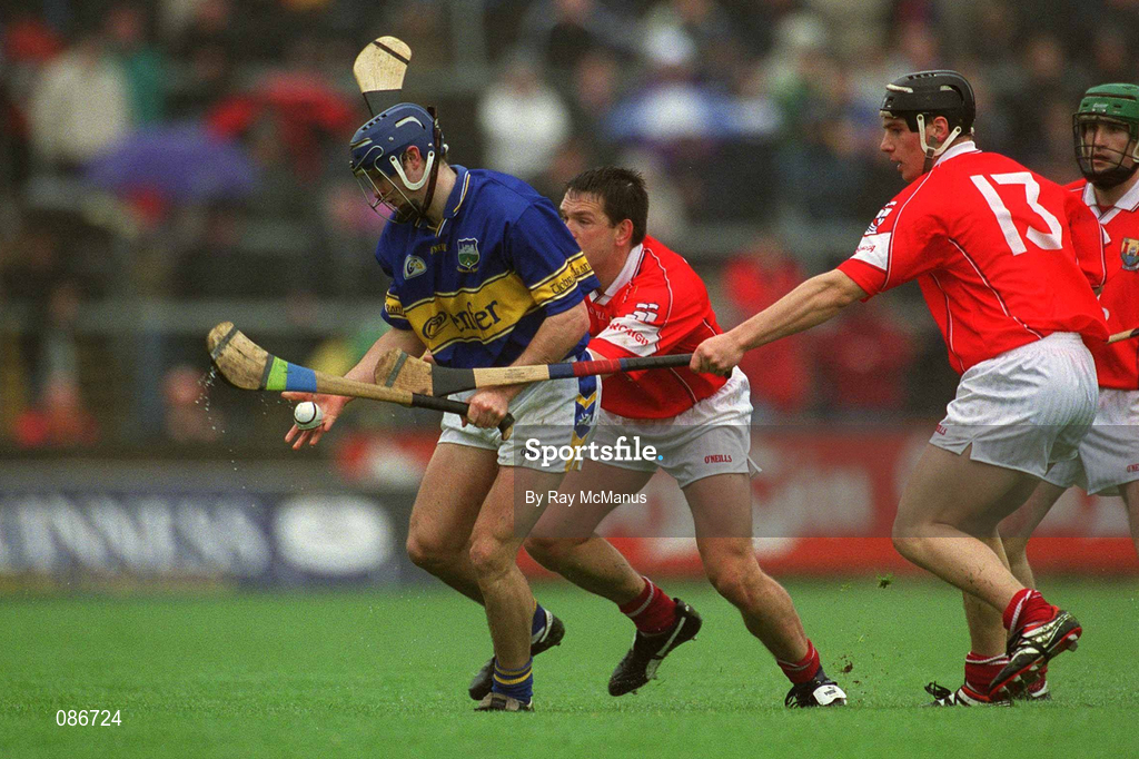 21 April 2002; Paul Kelly of Tipperary in action against Alan Browne and Eamonn Collins, 13, of Cork during the Allianz National Hurling League Semi-Final match between Cork and Tipperary at Páirc Uí Chaoimh in Cork. Photo by Ray McManus/Sportsfile