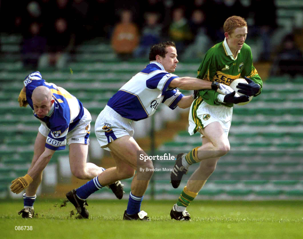 28 April 2002; Colm Cooper of Kerry goes past the challenge of Laois defenders Tom Kelly and Pauraic Leonard, left, on his way to scoring his side's first goal during the Allianz National Football League Division 2 Final match between Kerry and Laois at the Gaelic Grounds in Limerick. Photo by Brendan Moran/Sportsfile