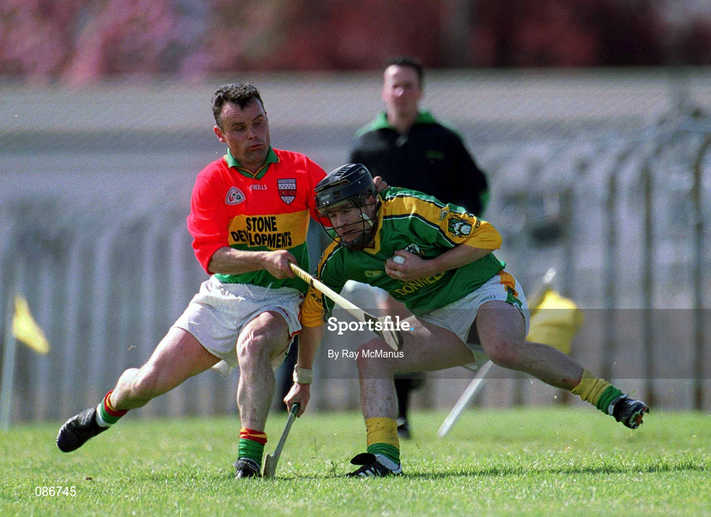 28 April 2002; Thomas Reilly of Meath is tackled by Johnny Nevin of Carlow during the Guinness Leinster Senior Hurling Championship First Round match between Carlow and Meath at Dr Cullen Park in Carlow. Photo by Ray McManus/Sportsfile