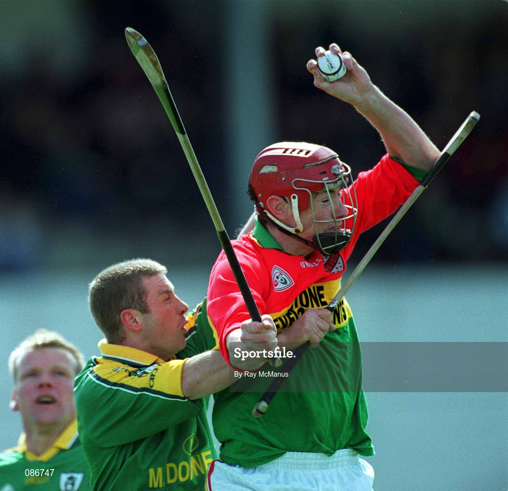 28 April 2002; Thomas Walsh of Carlow in action against Gay Kennedy of Meath during the Guinness Leinster Senior Hurling Championship First Round match between Carlow and Meath at Dr Cullen Park in Carlow. Photo by Ray McManus/Sportsfile